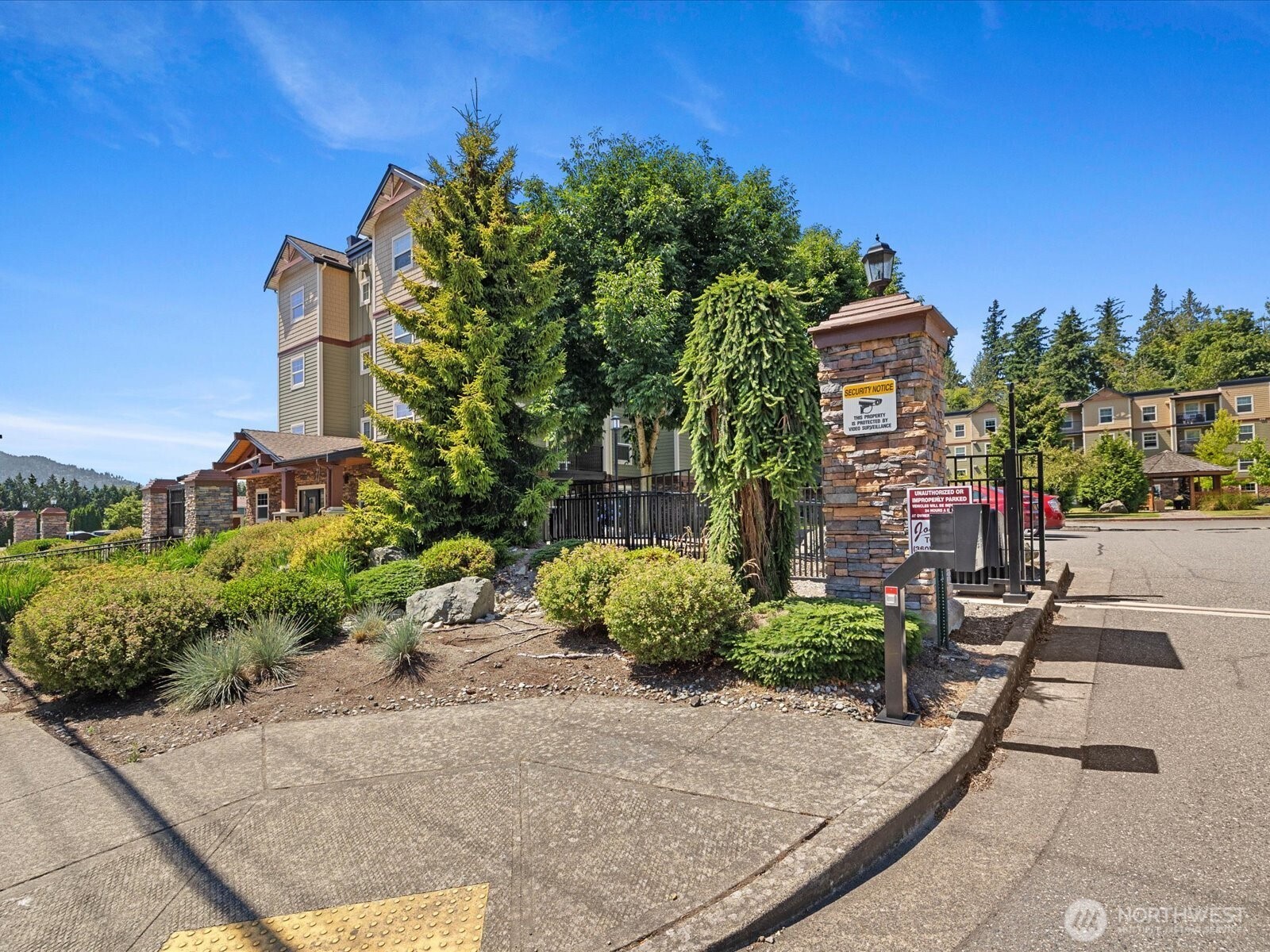 690 32nd Street, Unit B205 Bellingham, WA 98225 - Photo 7 of 40 a front view of a house with a yard and mountain