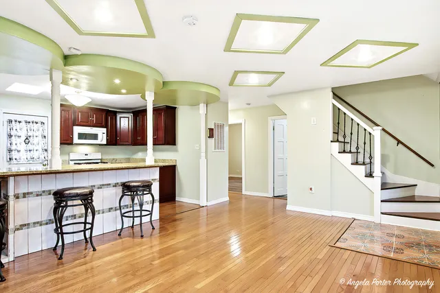 a lobby with furniture and a wooden floor