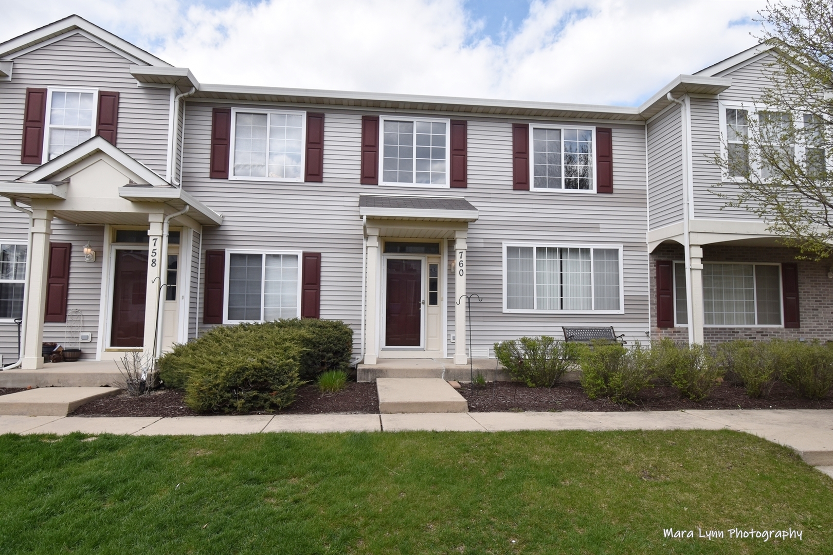 760 County Line Road Aurora, IL 60502 - Photo 1 of 25 a front view of a house with a garden and plants