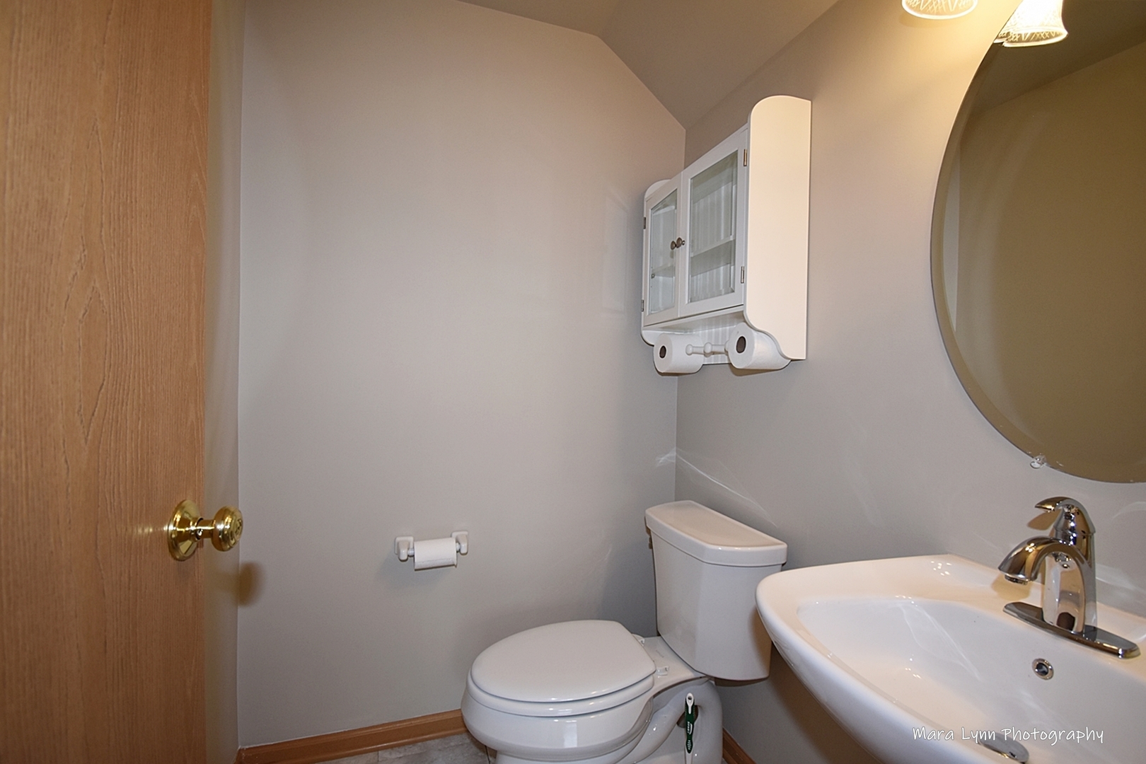 760 County Line Road Aurora, IL 60502 - Photo 15 of 25 a bathroom with a toilet and a sink