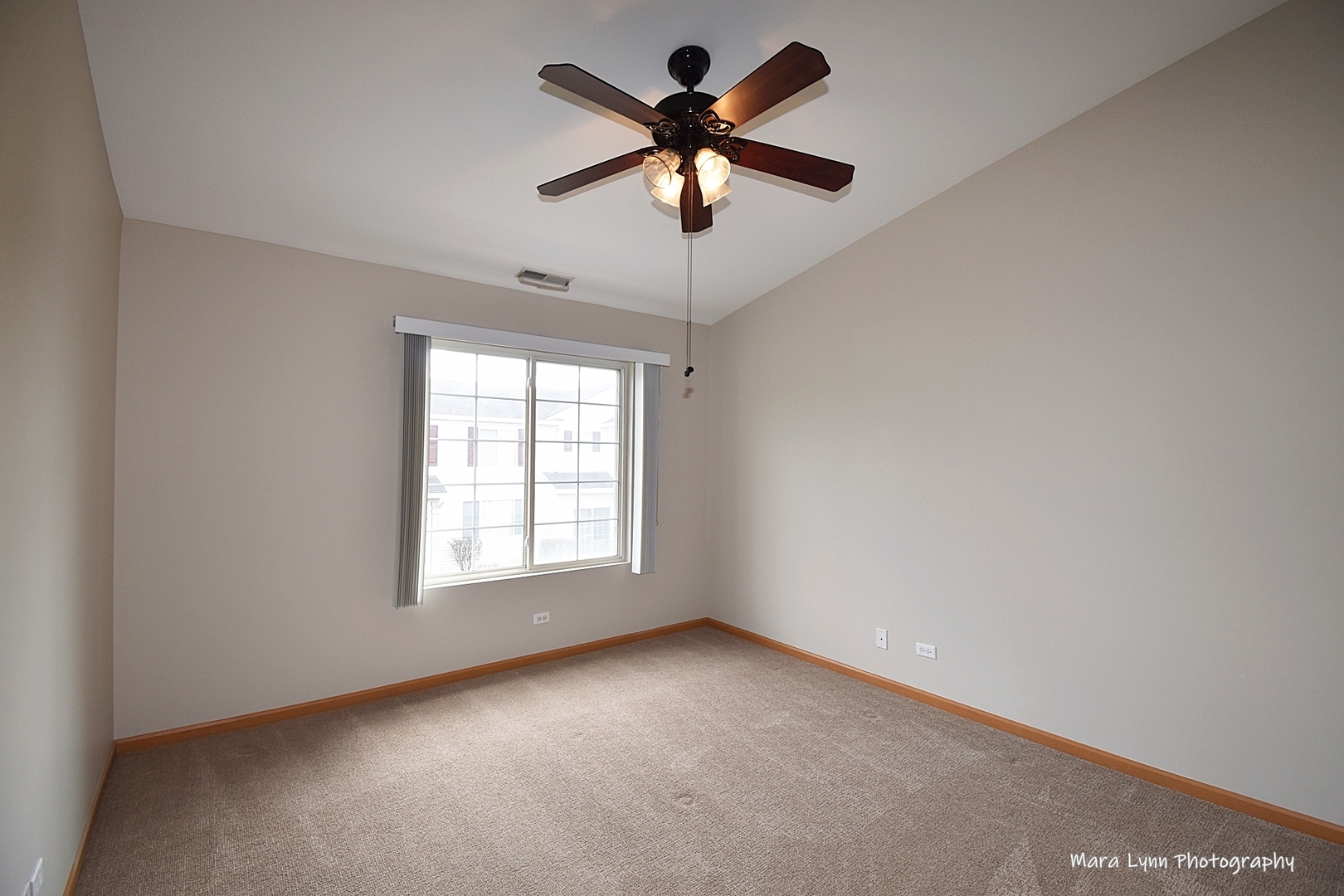 760 County Line Road Aurora, IL 60502 - Photo 16 of 25 a view of an empty room with a window
