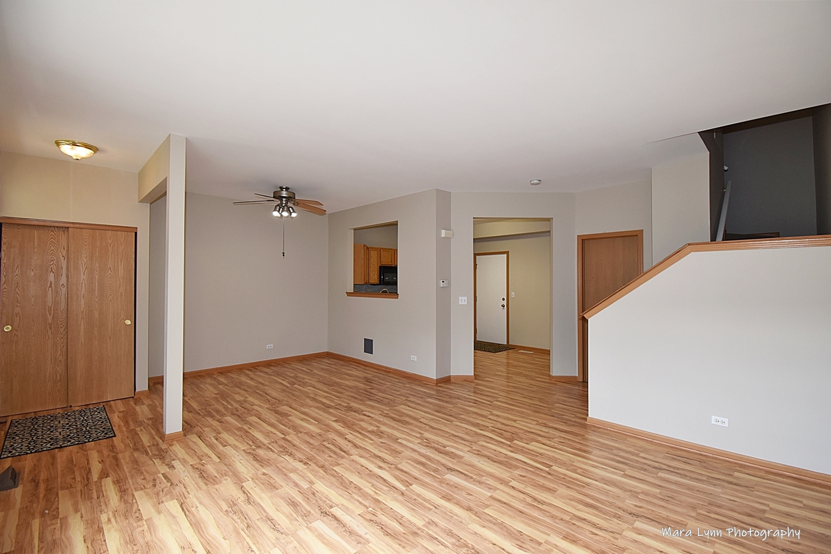 760 County Line Road Aurora, IL 60502 - Photo 6 of 25 a view of an empty room with wooden floor and a bathroom