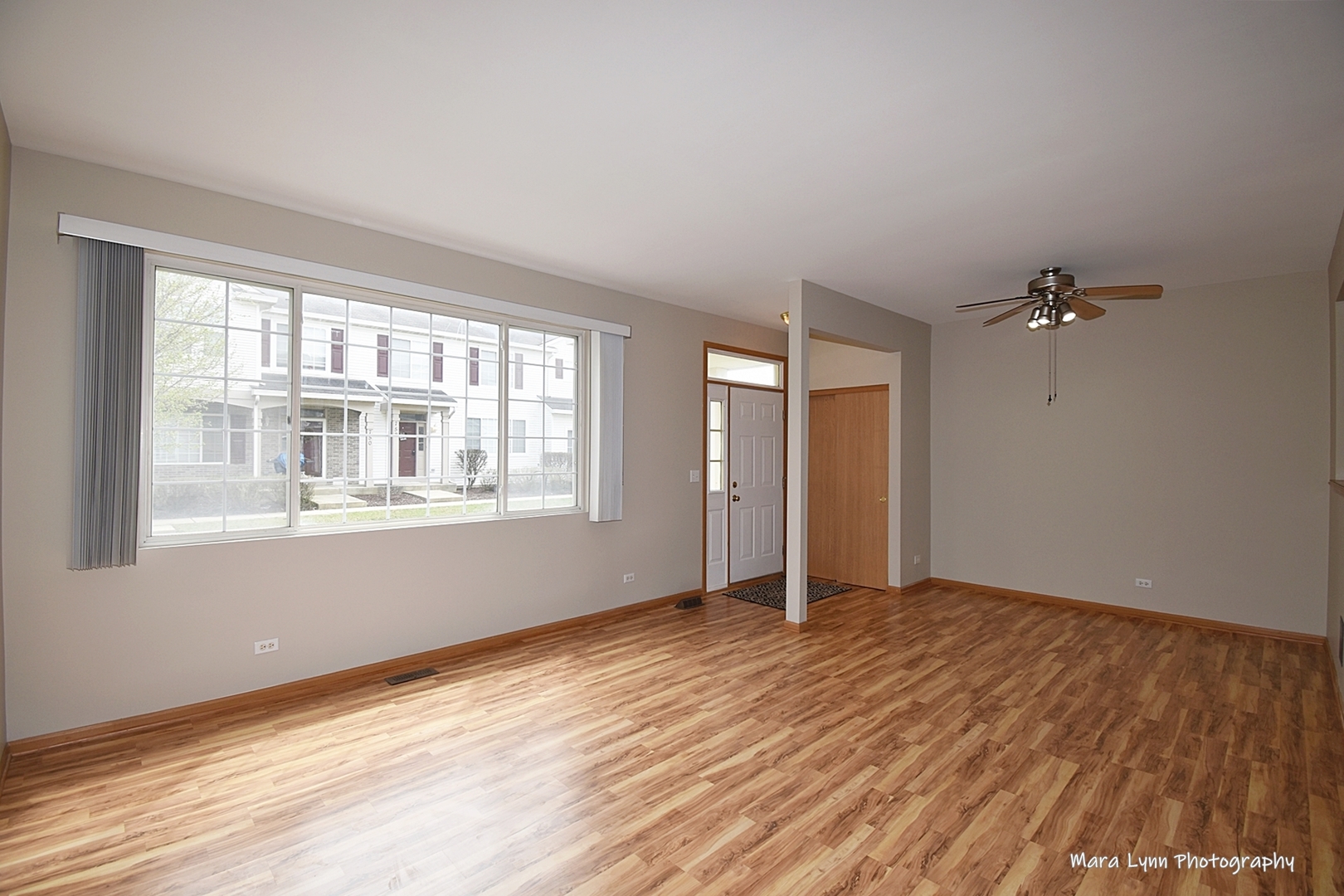 760 County Line Road Aurora, IL 60502 - Photo 8 of 25 a view of an empty room with wooden floor and a window