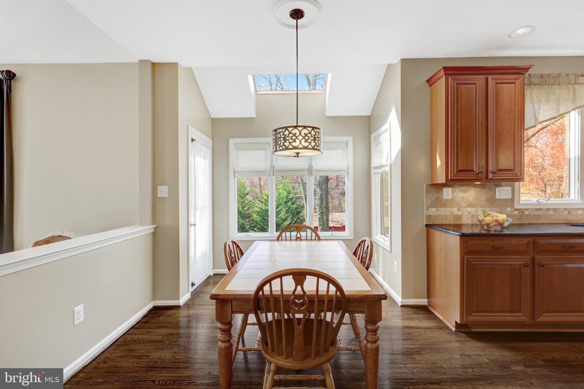12513 Ridgegate Drive Herndon, VA 20170 - Photo 24 of 72 a view of a dining room with furniture window and outside view