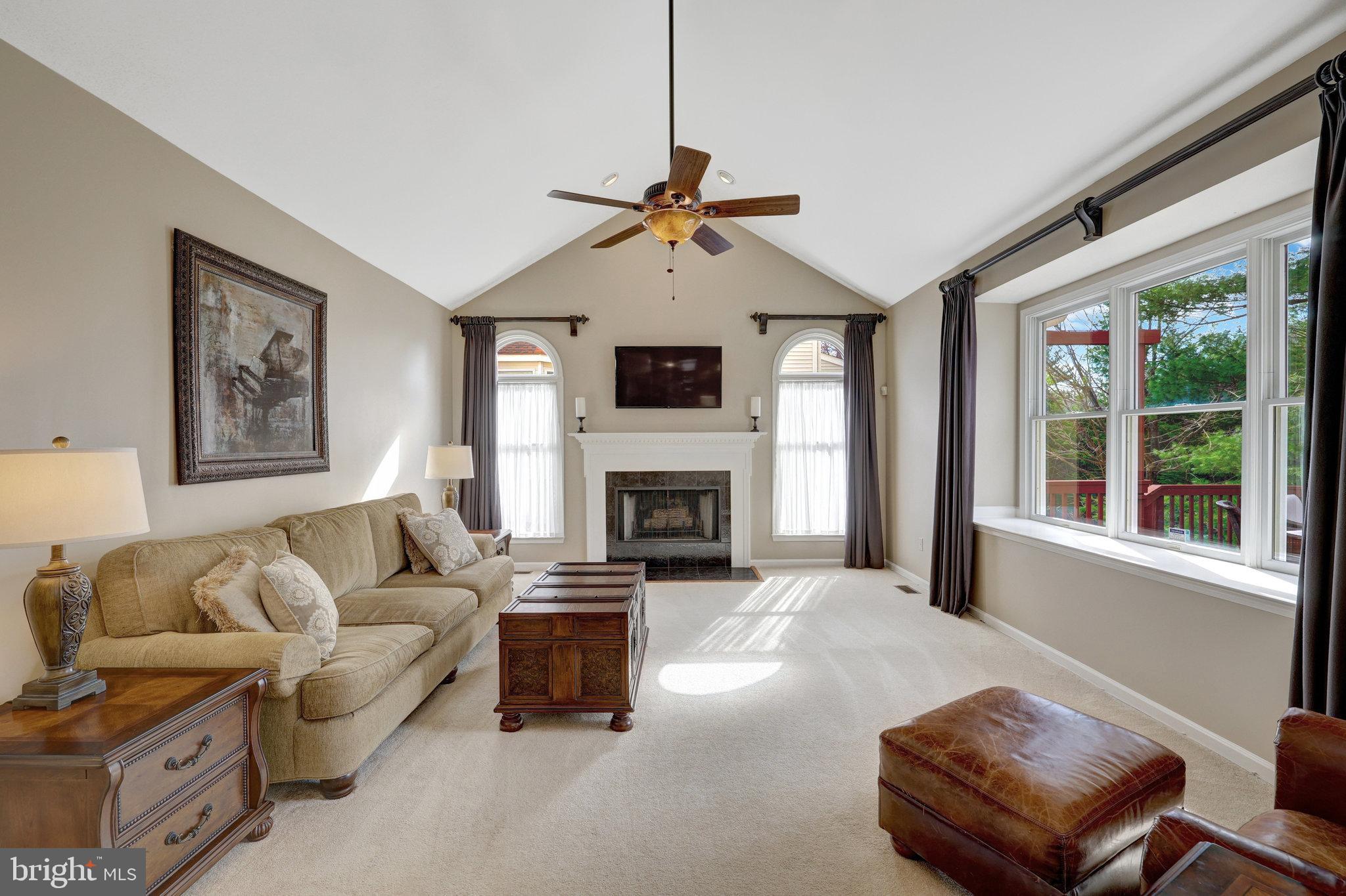 12513 Ridgegate Drive Herndon, VA 20170 - Photo 25 of 72 a living room with furniture a window and a fireplace