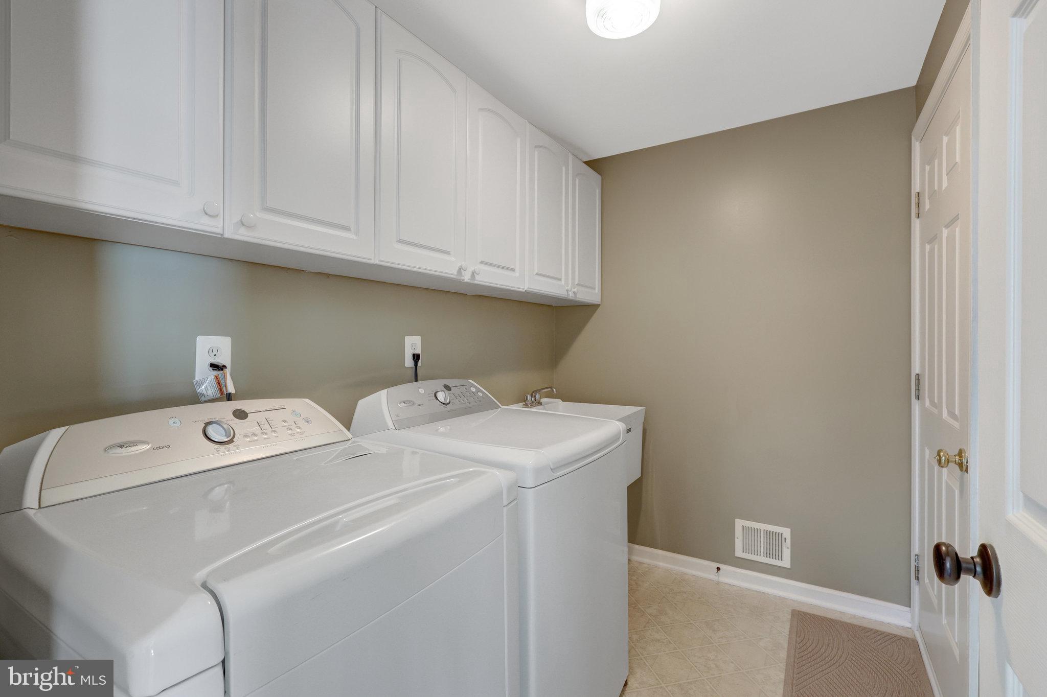 12513 Ridgegate Drive Herndon, VA 20170 - Photo 29 of 72 a utility room with dryer and washer
