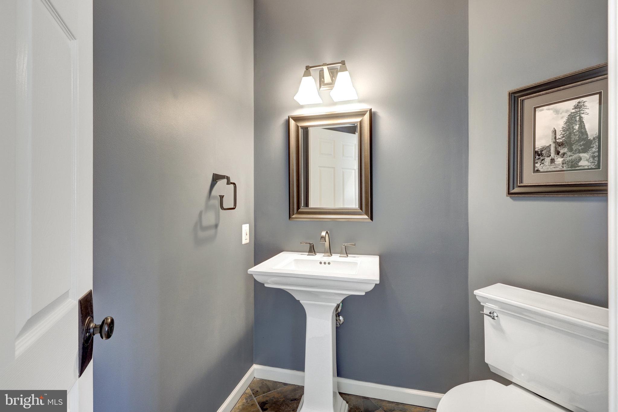 12513 Ridgegate Drive Herndon, VA 20170 - Photo 30 of 72 a bathroom with a toilet sink and mirror