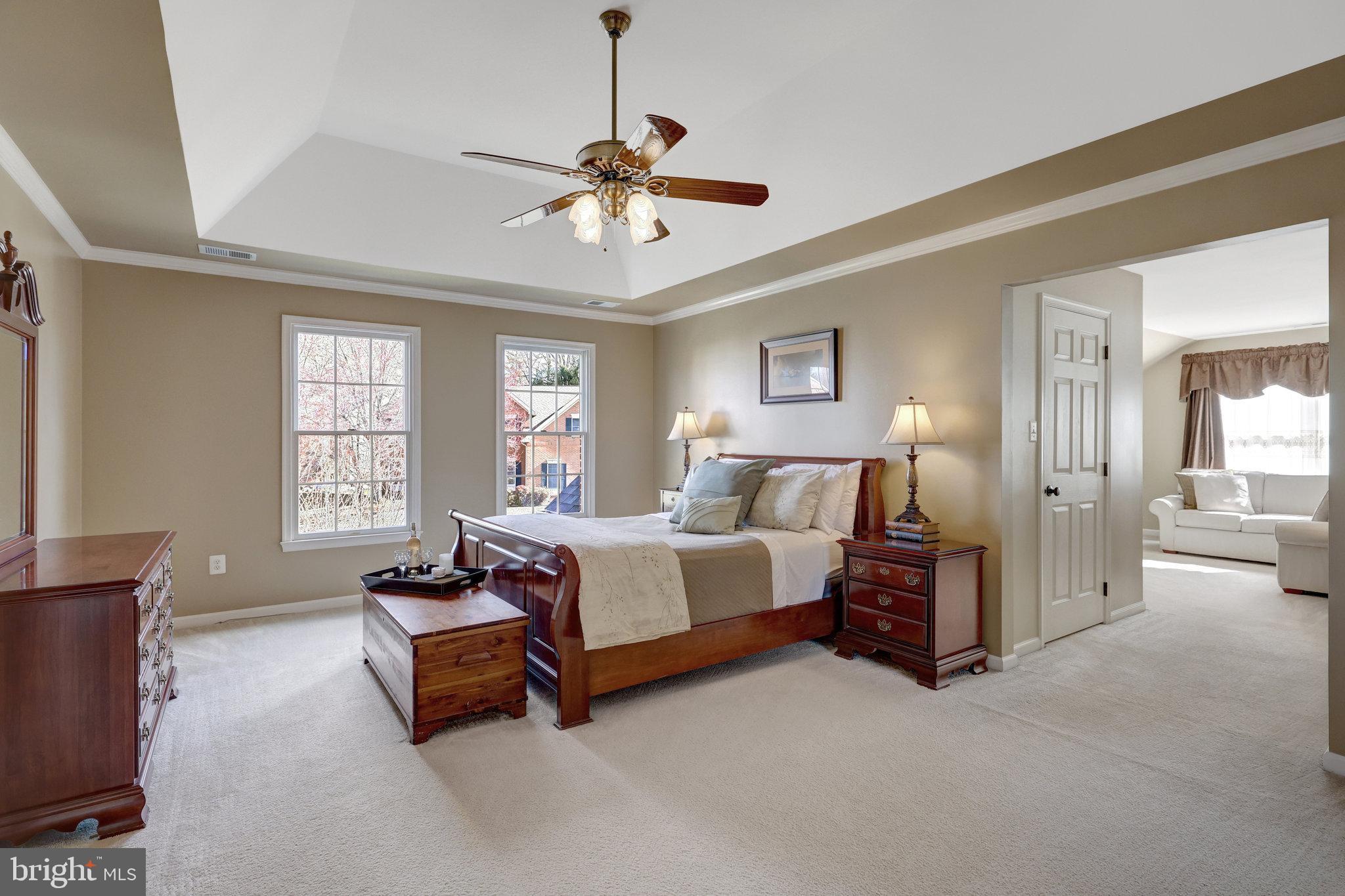 12513 Ridgegate Drive Herndon, VA 20170 - Photo 32 of 72 a spacious bedroom with a bed and furniture