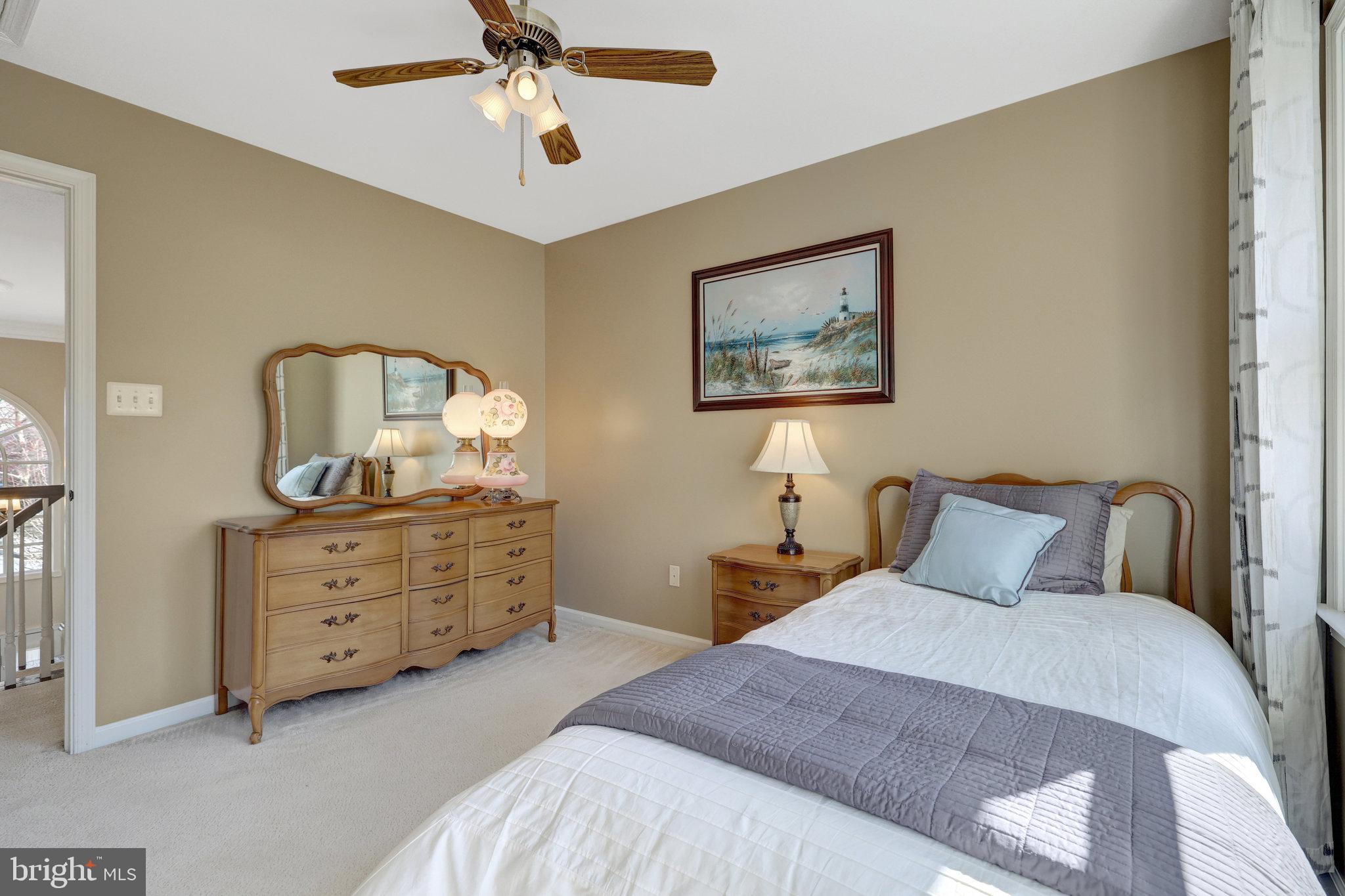 12513 Ridgegate Drive Herndon, VA 20170 - Photo 41 of 72 a bedroom with a bed and a dresser