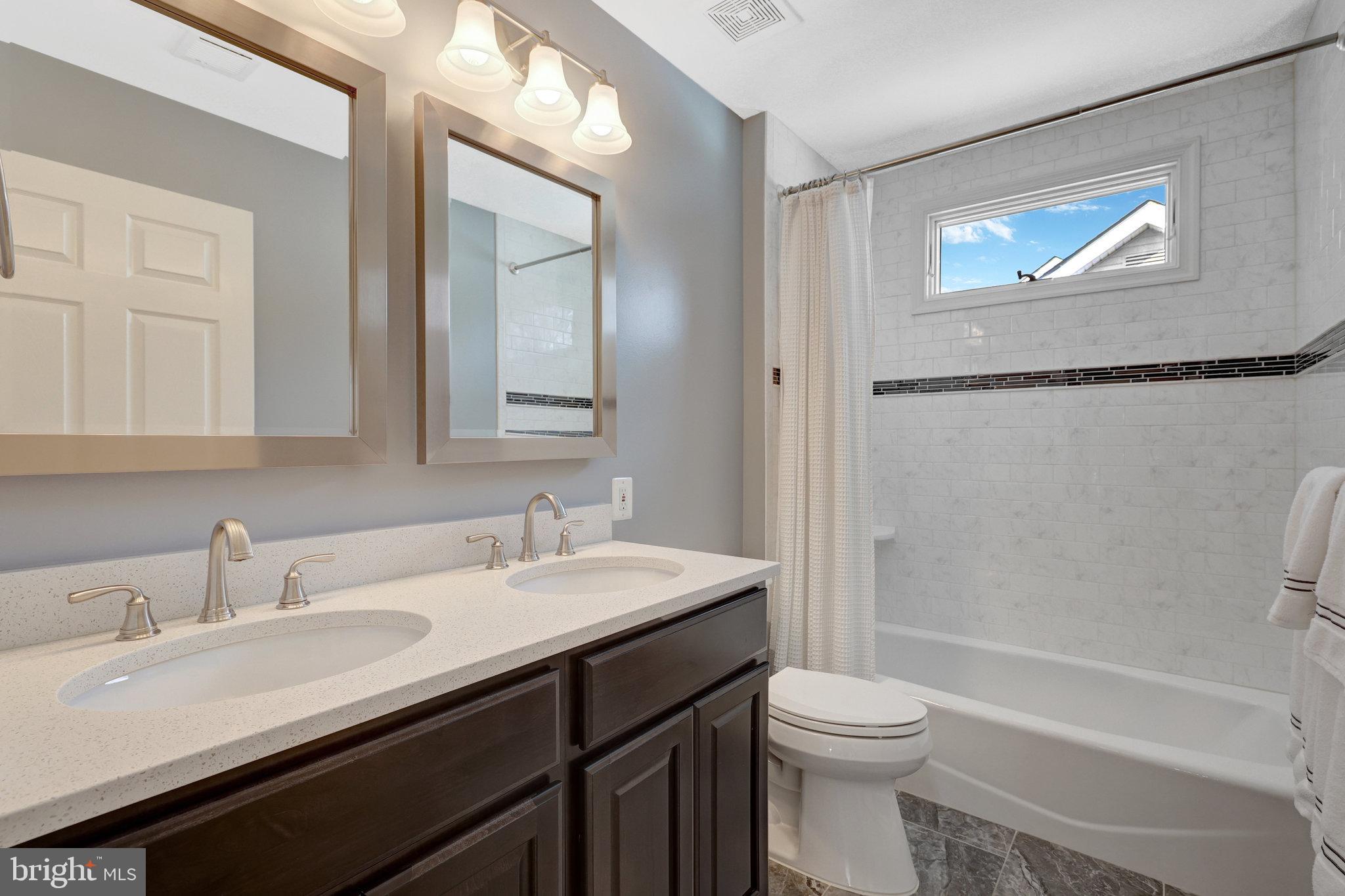12513 Ridgegate Drive Herndon, VA 20170 - Photo 43 of 72 a bathroom with a sink a toilet and a bathtub