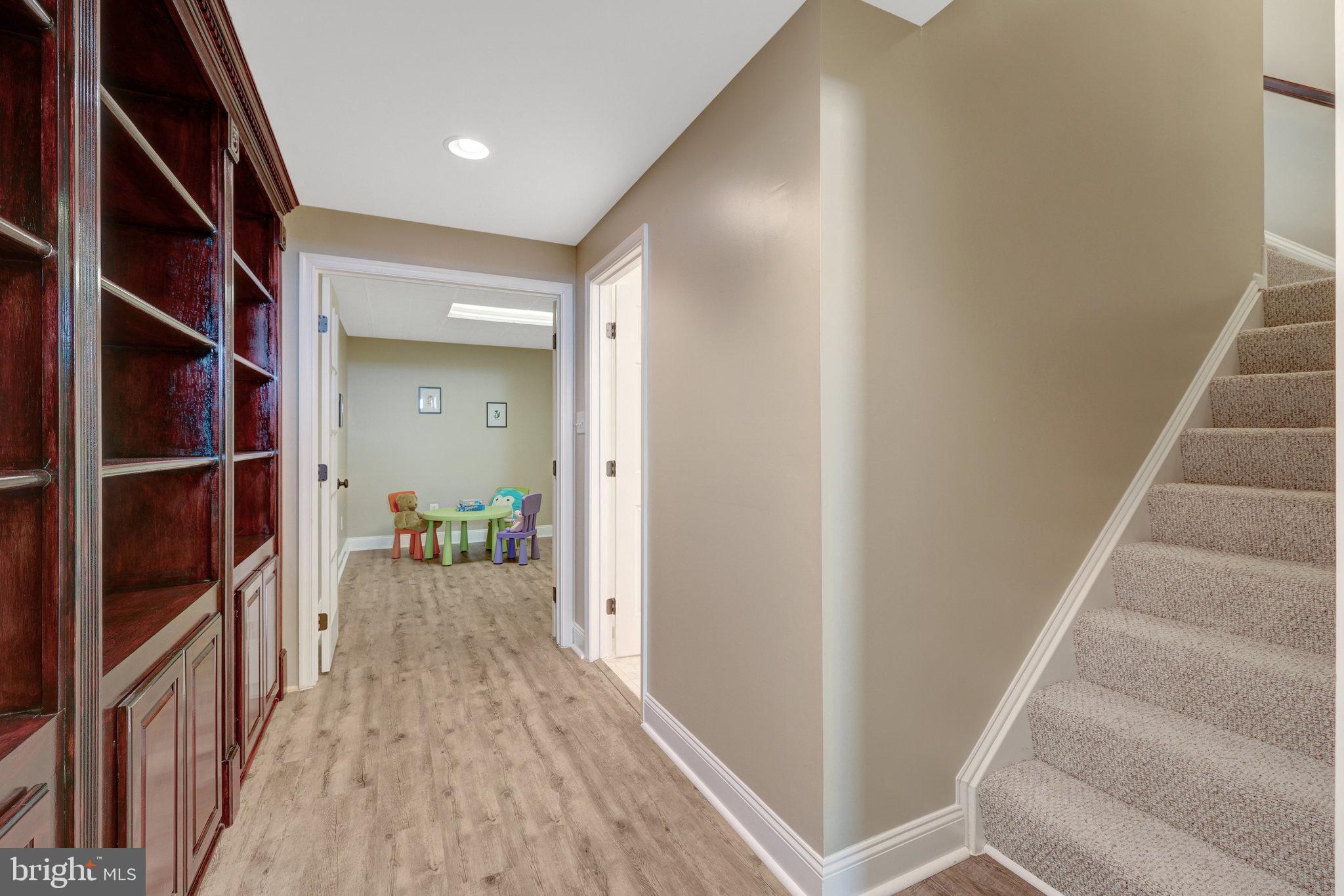 12513 Ridgegate Drive Herndon, VA 20170 - Photo 47 of 72 a view of a hallway with wooden floor and entryway
