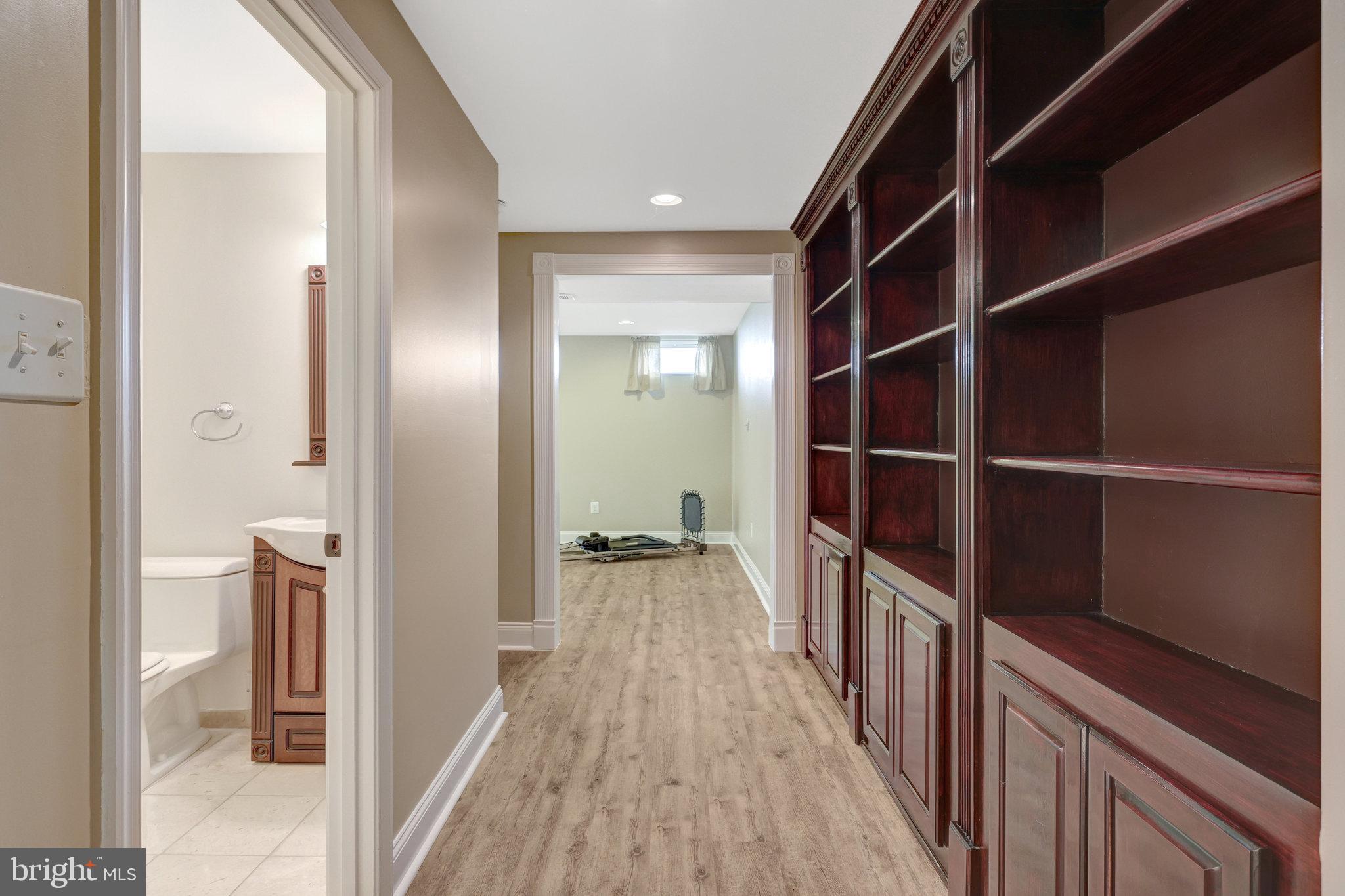 12513 Ridgegate Drive Herndon, VA 20170 - Photo 49 of 72 Lower-level hallway and built-ins