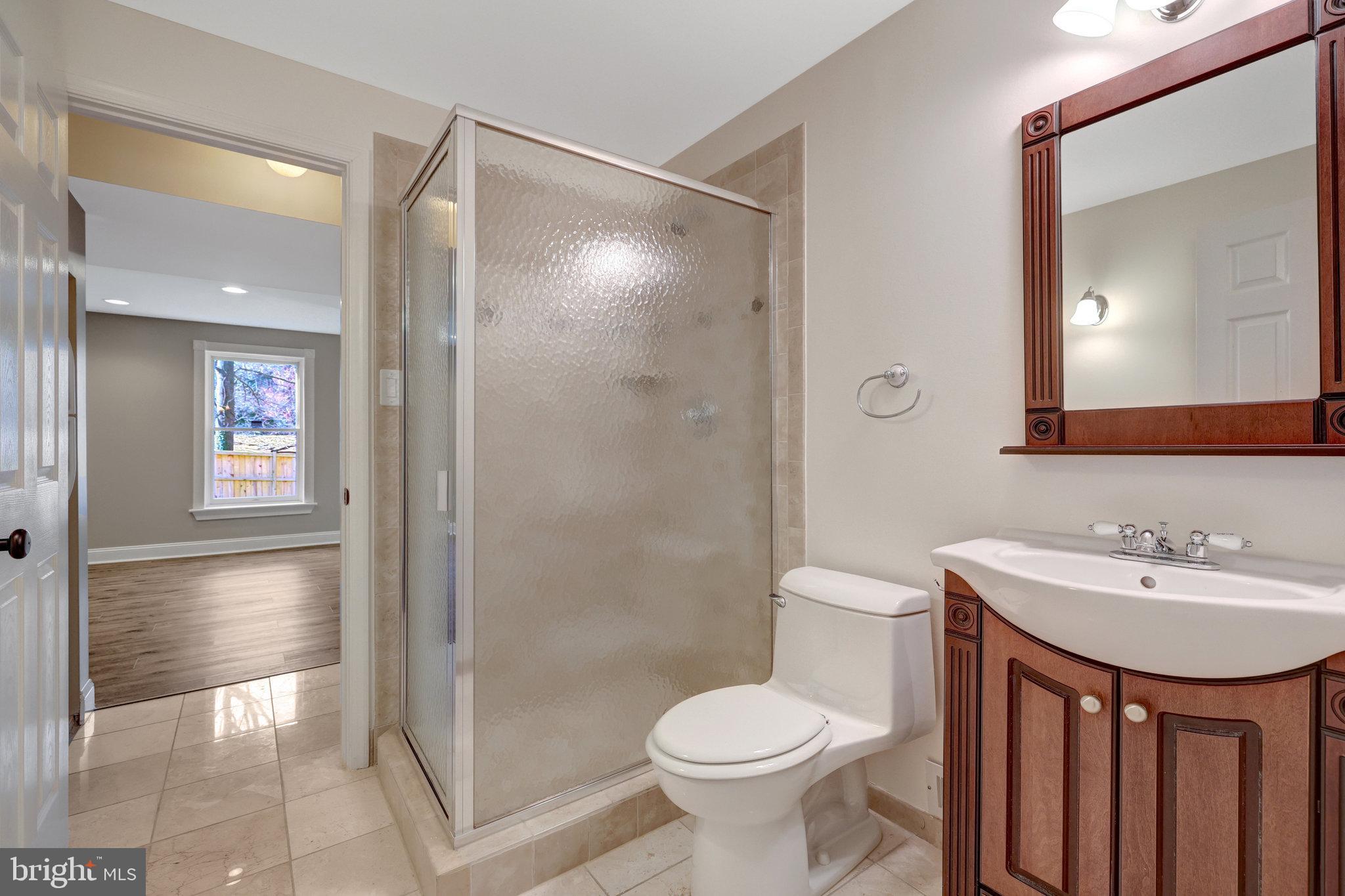 12513 Ridgegate Drive Herndon, VA 20170 - Photo 50 of 72 a bathroom with a sink toilet and shower