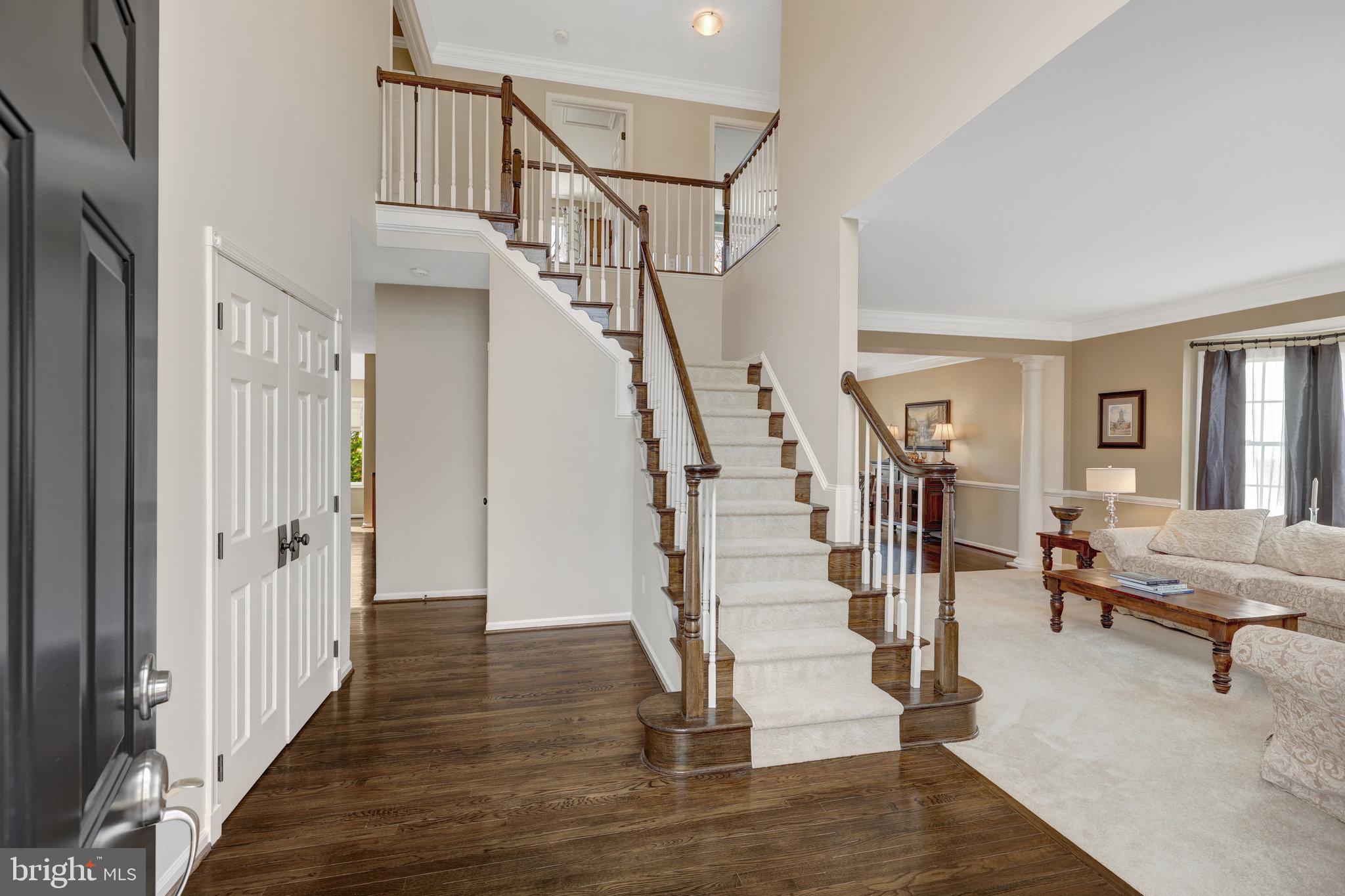 12513 Ridgegate Drive Herndon, VA 20170 - Photo 5 of 72 a view of entryway with wooden floor and stairs