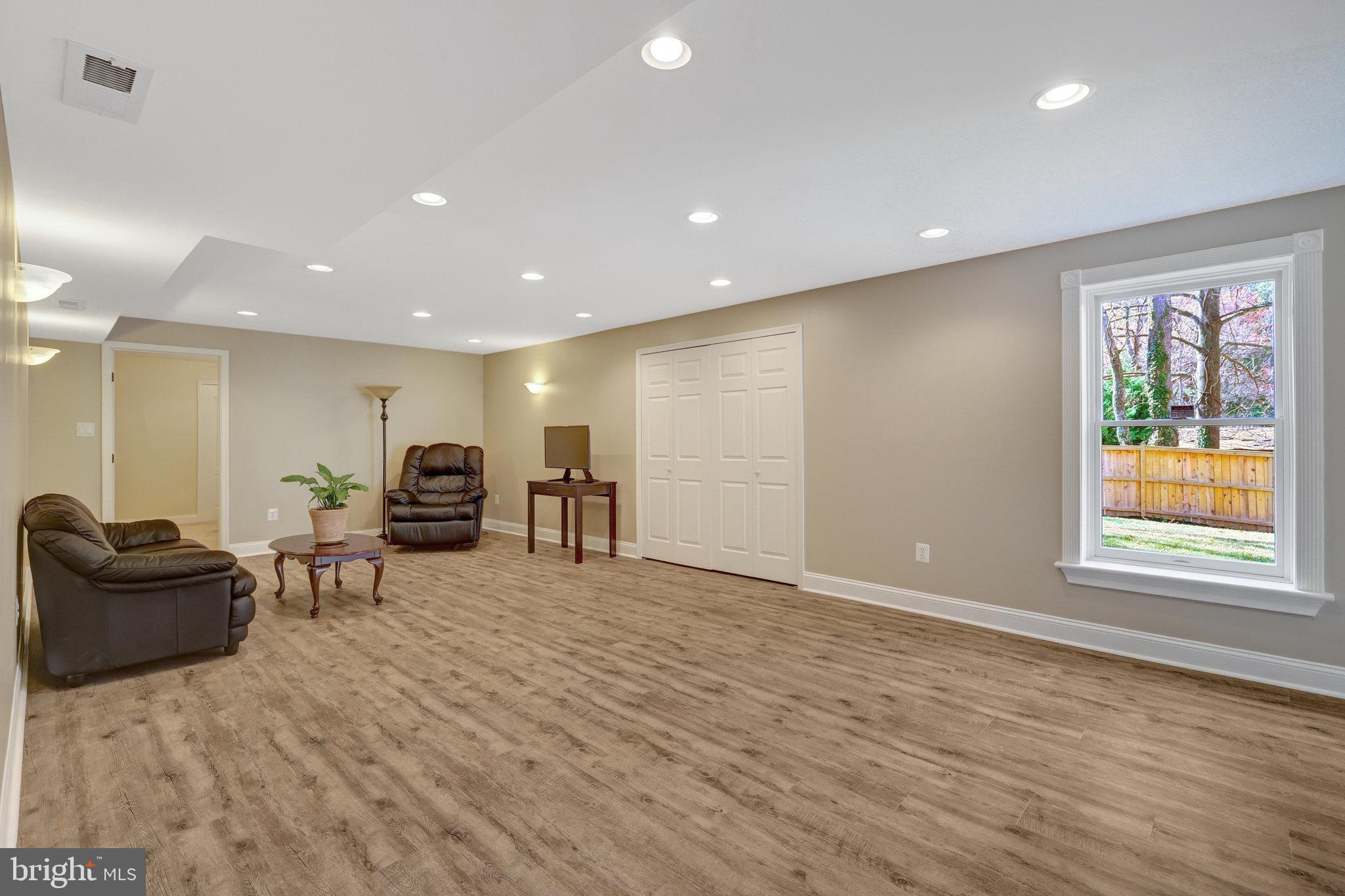 12513 Ridgegate Drive Herndon, VA 20170 - Photo 55 of 72 a view of a livingroom with furniture window and wooden floor