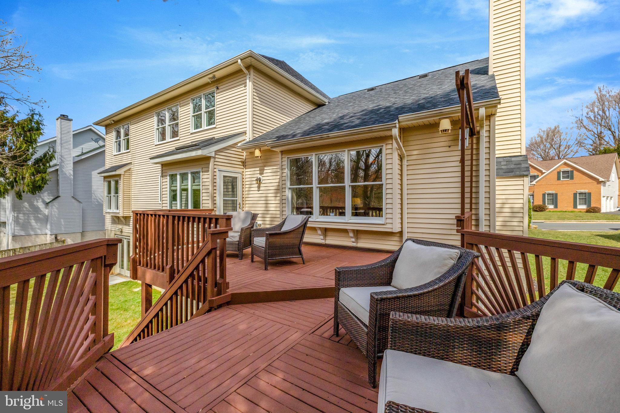 12513 Ridgegate Drive Herndon, VA 20170 - Photo 63 of 72 a view of a house with wooden deck and furniture