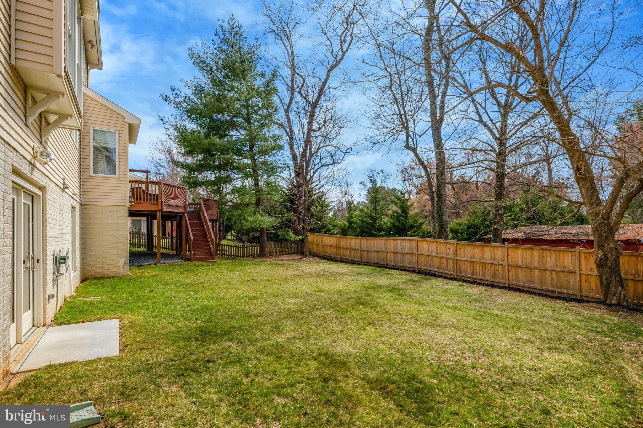 12513 Ridgegate Drive Herndon, VA 20170 - Photo 65 of 72 a view of a backyard with large trees