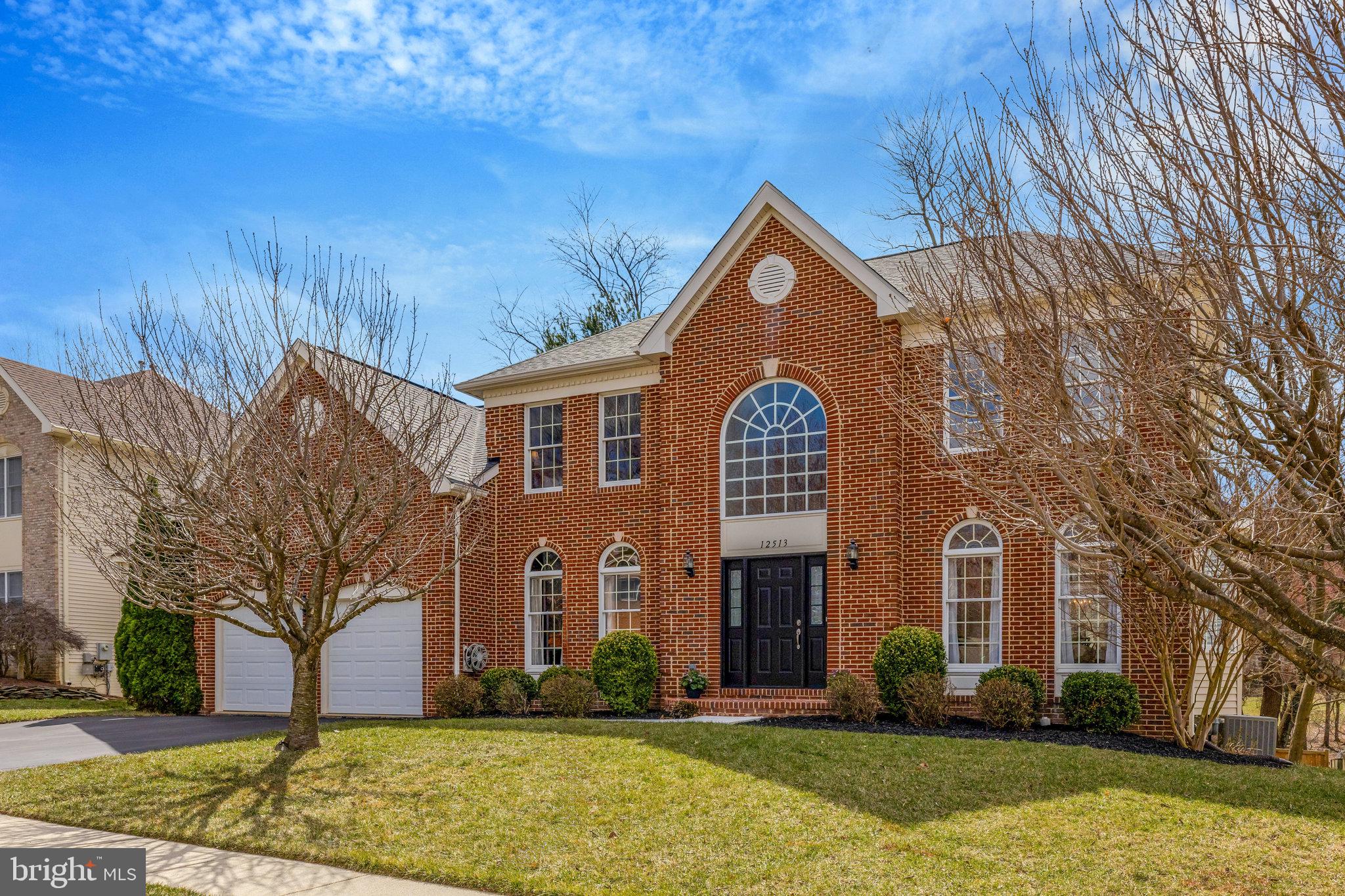 12513 Ridgegate Drive Herndon, VA 20170 - Photo 72 of 72 a view of a brick house with a yard