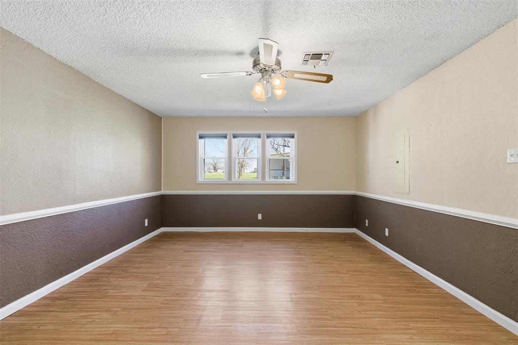 755 County Road 4280 Decatur, TX 76234 - Photo 16 of 36 a view of room with window and hardwood floor