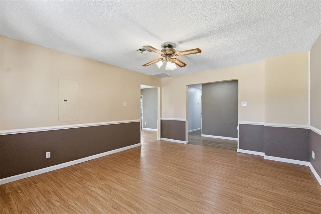 755 County Road 4280 Decatur, TX 76234 - Photo 17 of 36 a view of an empty room with window and wooden floor
