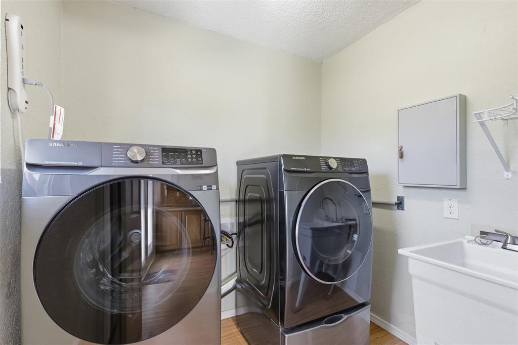 755 County Road 4280 Decatur, TX 76234 - Photo 20 of 36 a utility room with dryer and washer