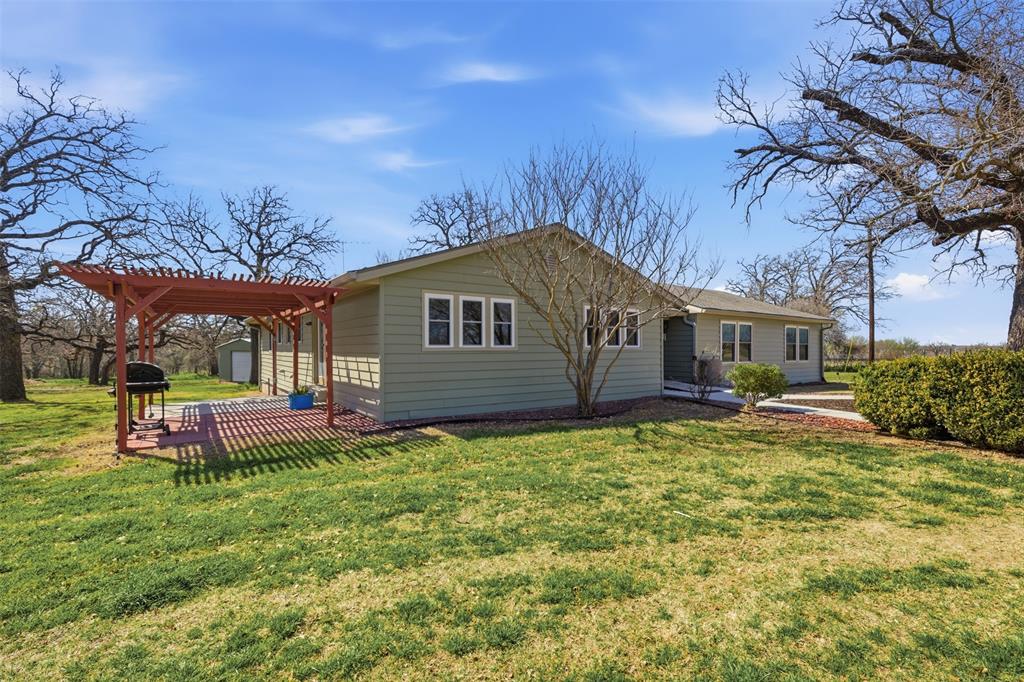 755 County Road 4280 Decatur, TX 76234 - Photo 4 of 36 a front view of house with yard and seating area