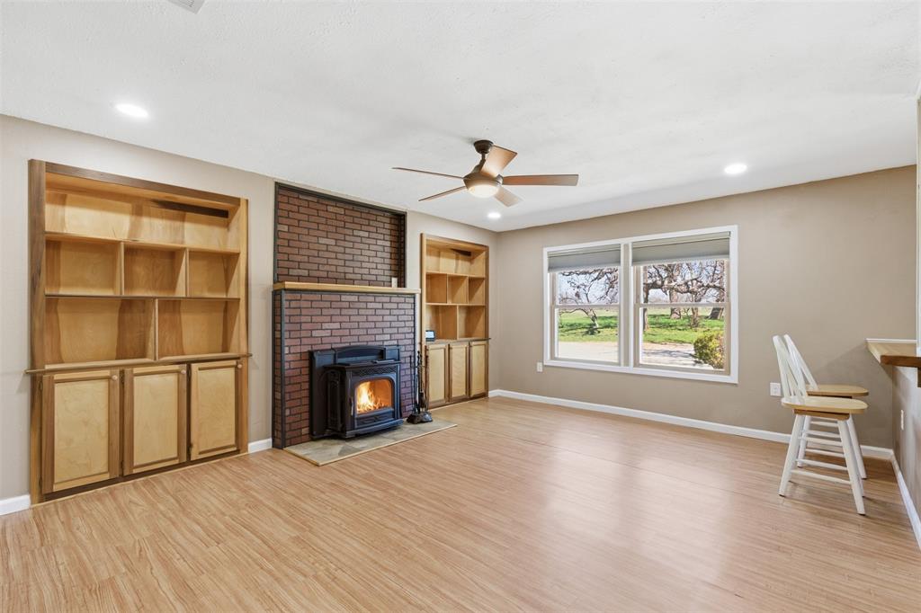 755 County Road 4280 Decatur, TX 76234 - Photo 9 of 36 a view of a livingroom with furniture and a fireplace