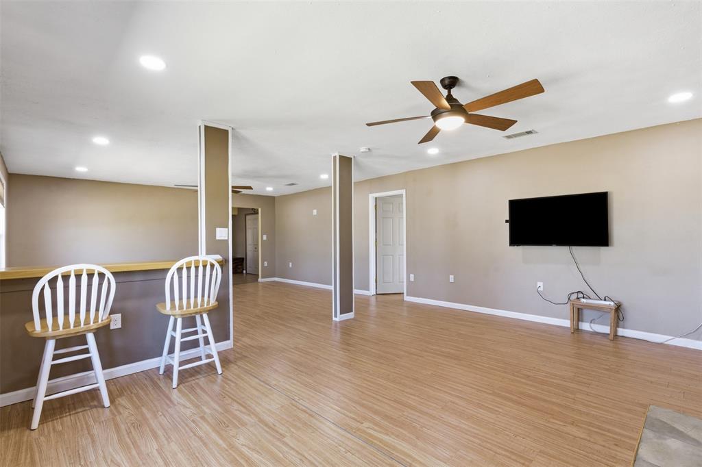 755 County Road 4280 Decatur, TX 76234 - Photo 10 of 36 a view of room with wooden floor and windows