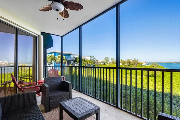 a view of balcony with furniture