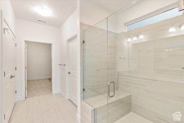 2033 Fortune Lane, Unit 462 Mapleton, UT 84664 - Photo 17 of 27 Primary bathroom with walk in shower and bench seat and Euro glass and double sinks