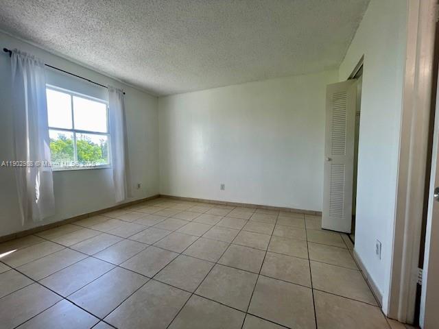 8260 Southwest 210th Street, Unit 311 Cutler Bay, FL 33189 - Photo 2 of 17 an empty room with windows