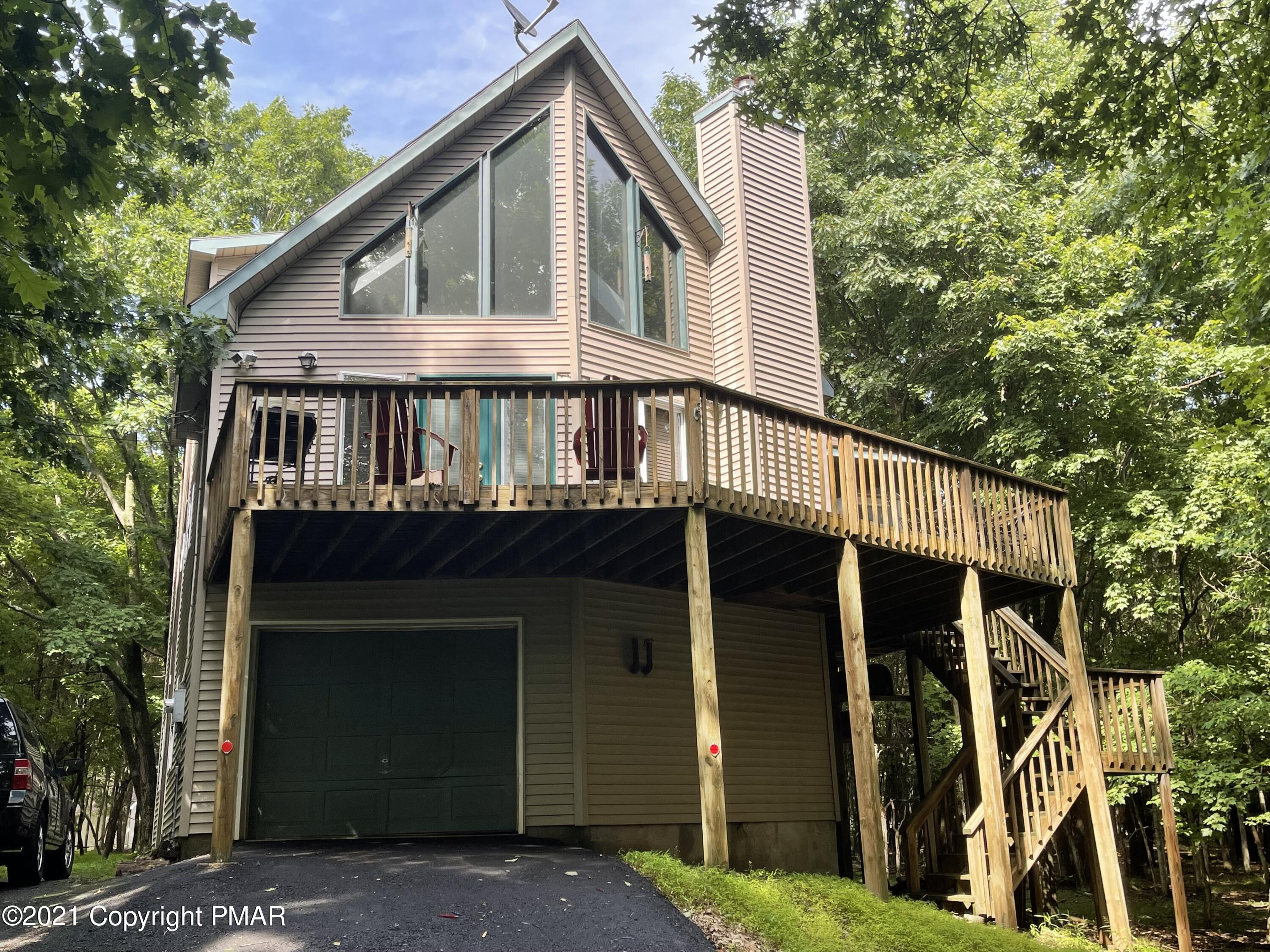 131 Maple Road Blakeslee, PA 18610 - Photo 1 of 35 a front view of a house with balcony