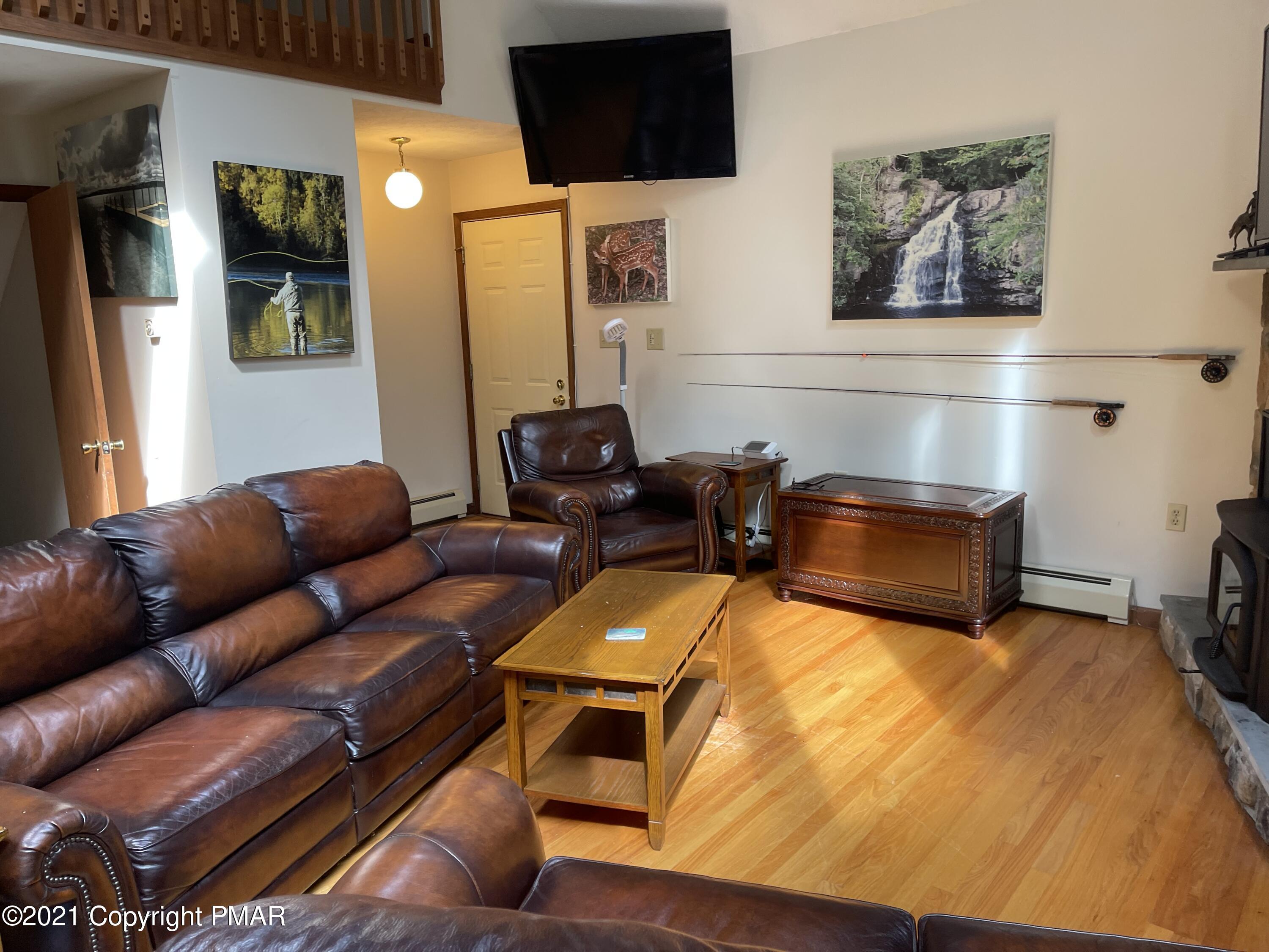 131 Maple Road Blakeslee, PA 18610 - Photo 12 of 35 a living room with furniture and a flat screen tv