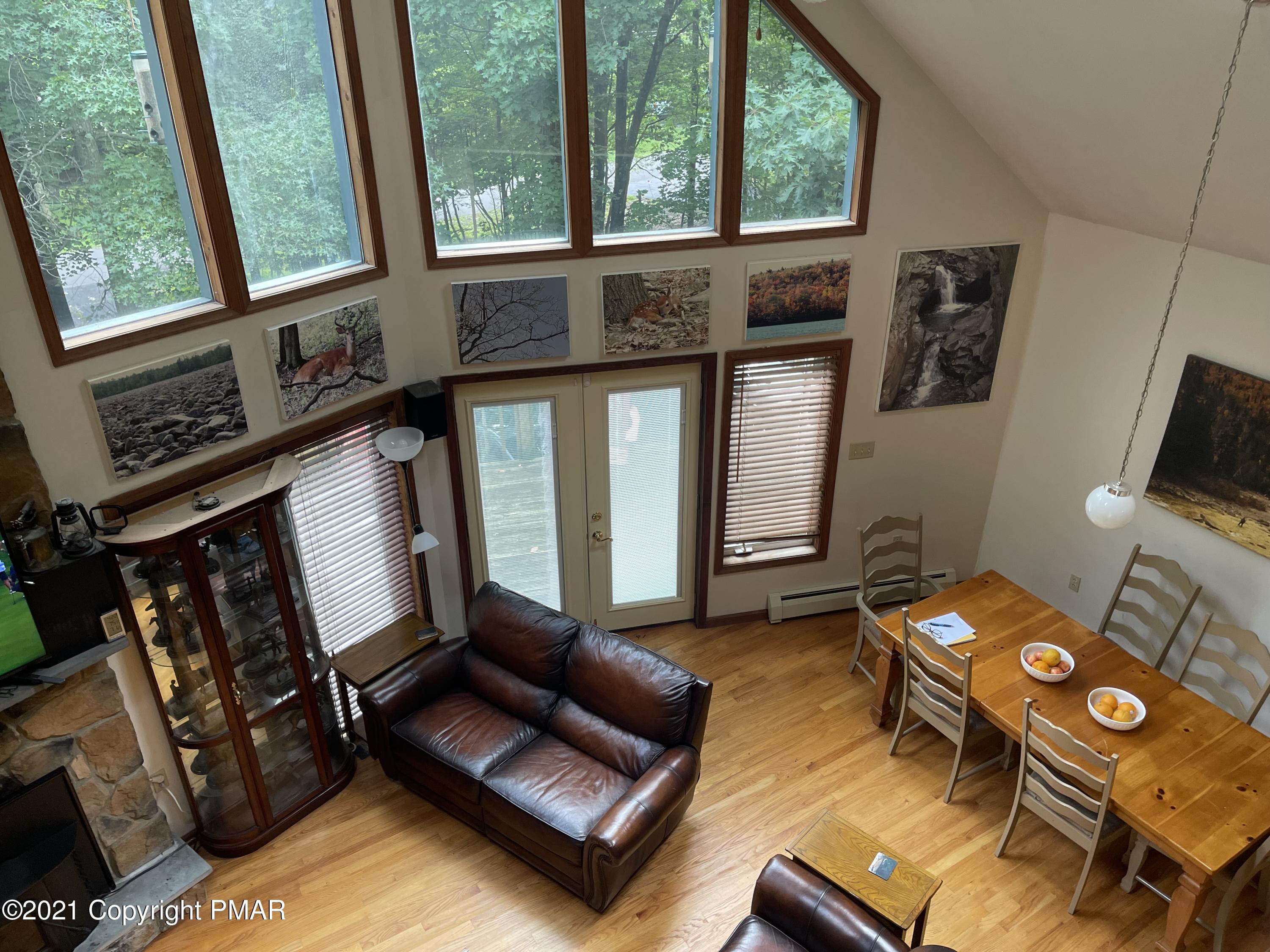131 Maple Road Blakeslee, PA 18610 - Photo 14 of 35 a living room with furniture and a window
