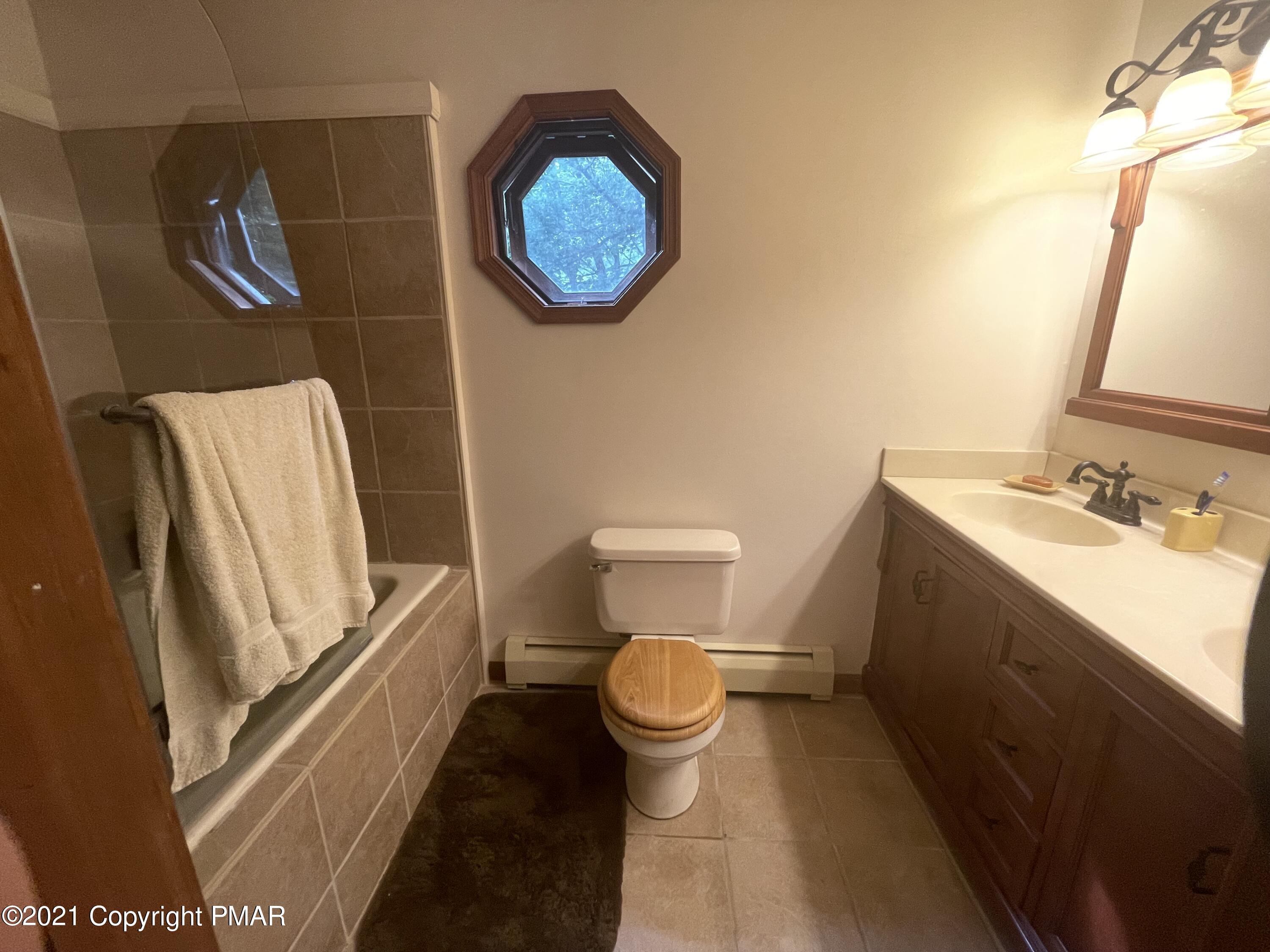 131 Maple Road Blakeslee, PA 18610 - Photo 17 of 35 a bathroom with a toilet and a sink