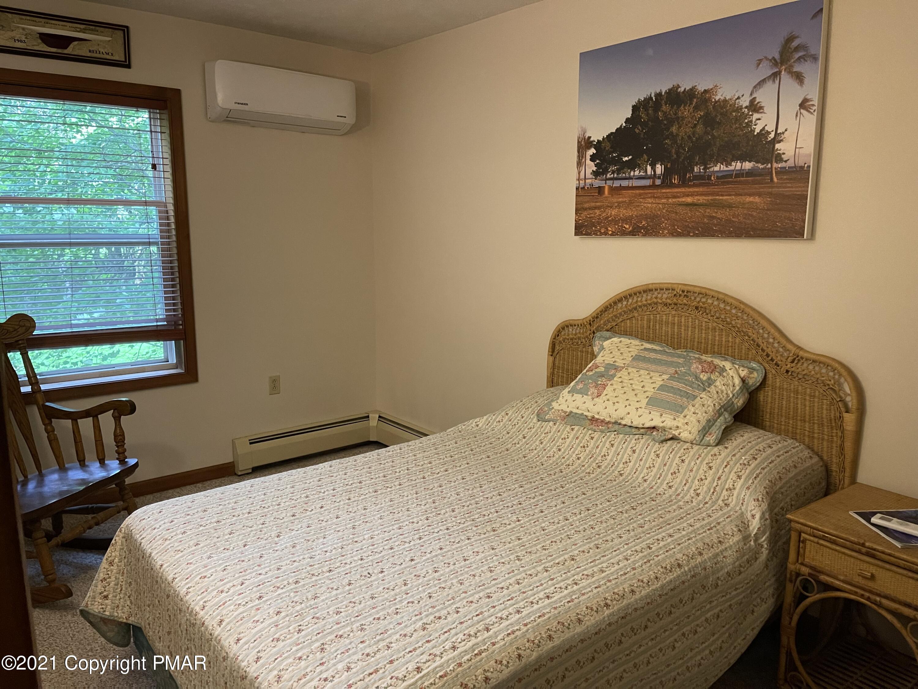 131 Maple Road Blakeslee, PA 18610 - Photo 18 of 35 a bedroom with a bed and a window