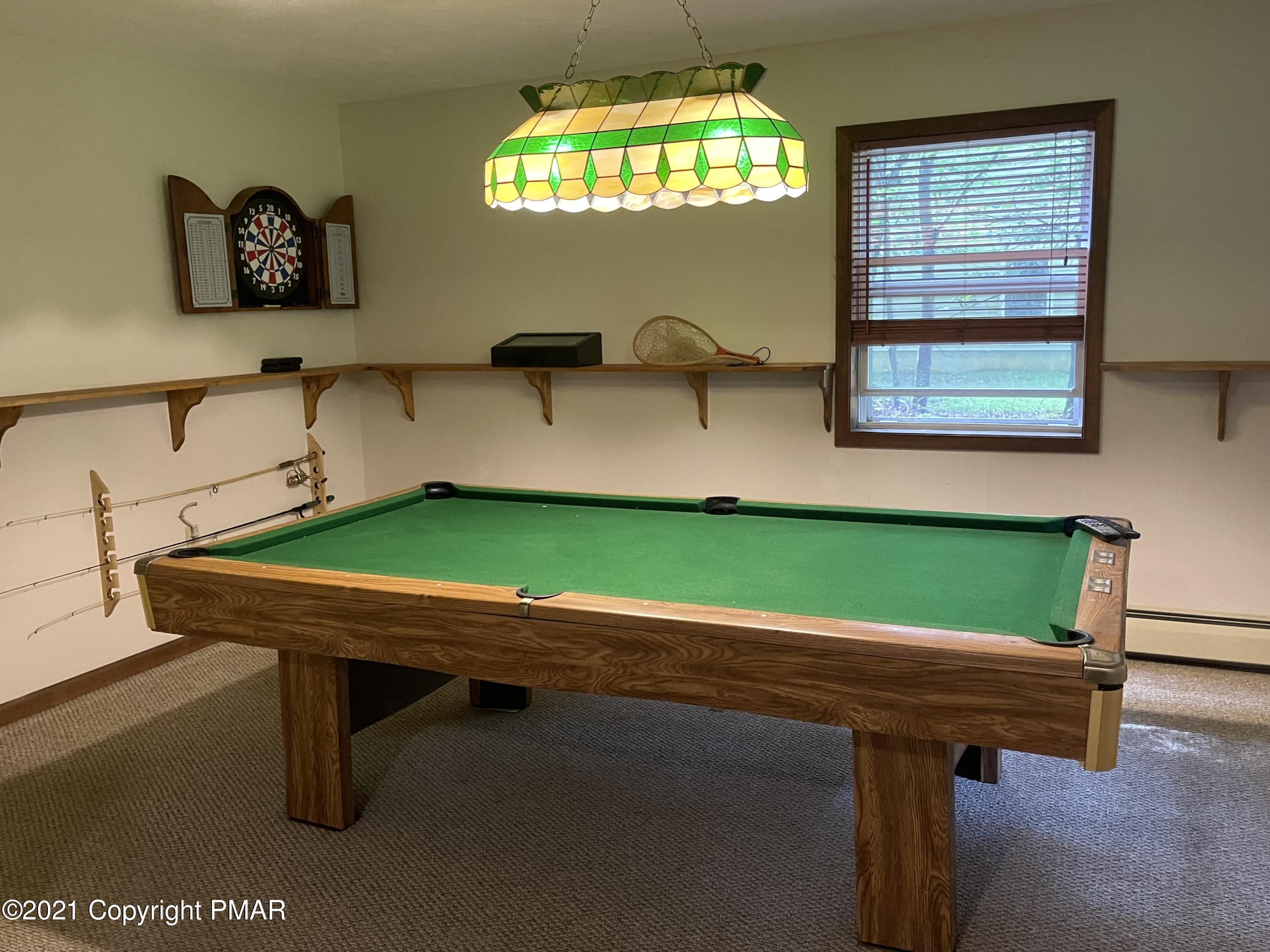 131 Maple Road Blakeslee, PA 18610 - Photo 24 of 35 a room with a table chair and windows