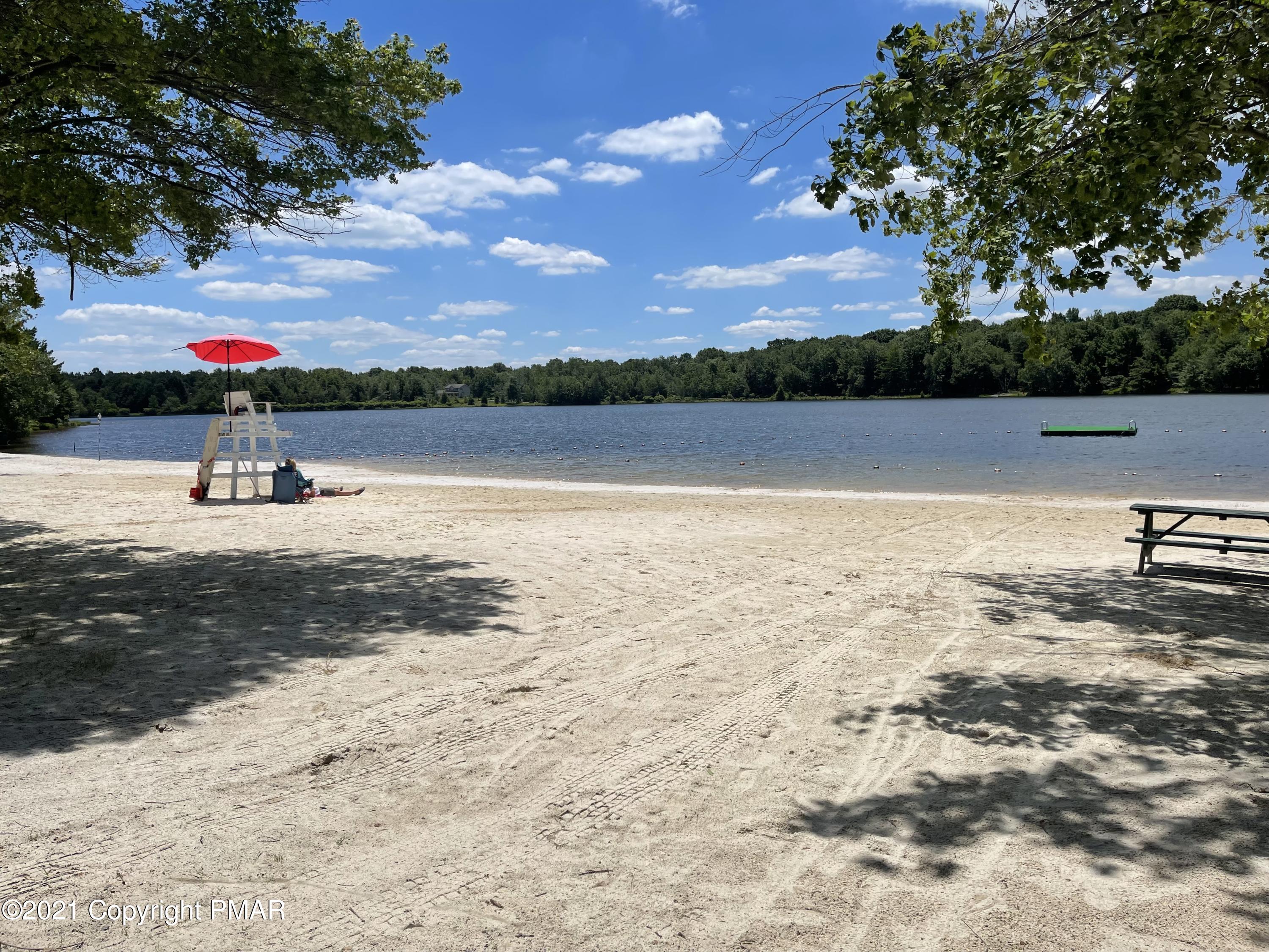 131 Maple Road Blakeslee, PA 18610 - Photo 33 of 35 a view of a lake with a yard