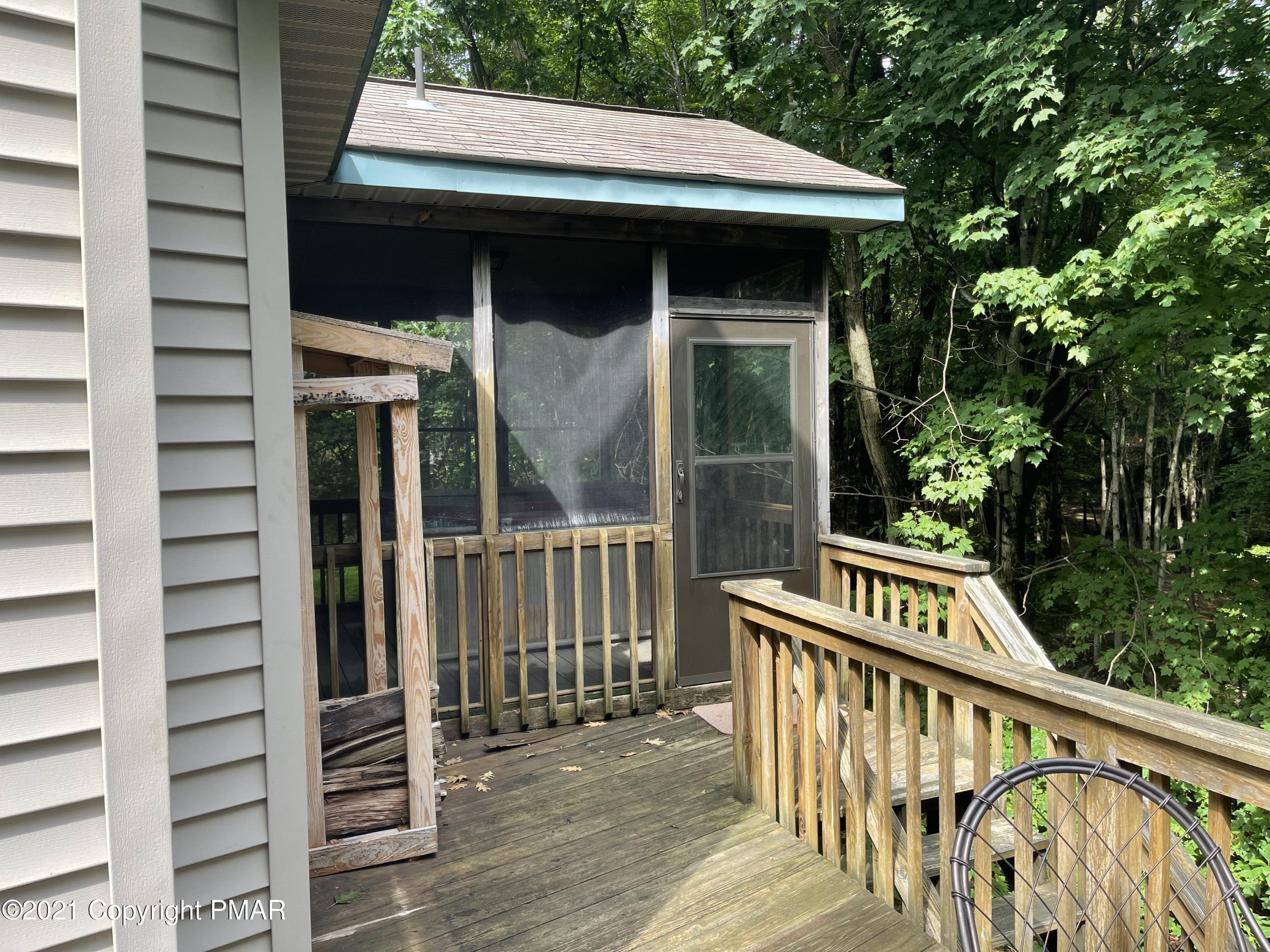 131 Maple Road Blakeslee, PA 18610 - Photo 6 of 35 a view of a wooden deck front of house
