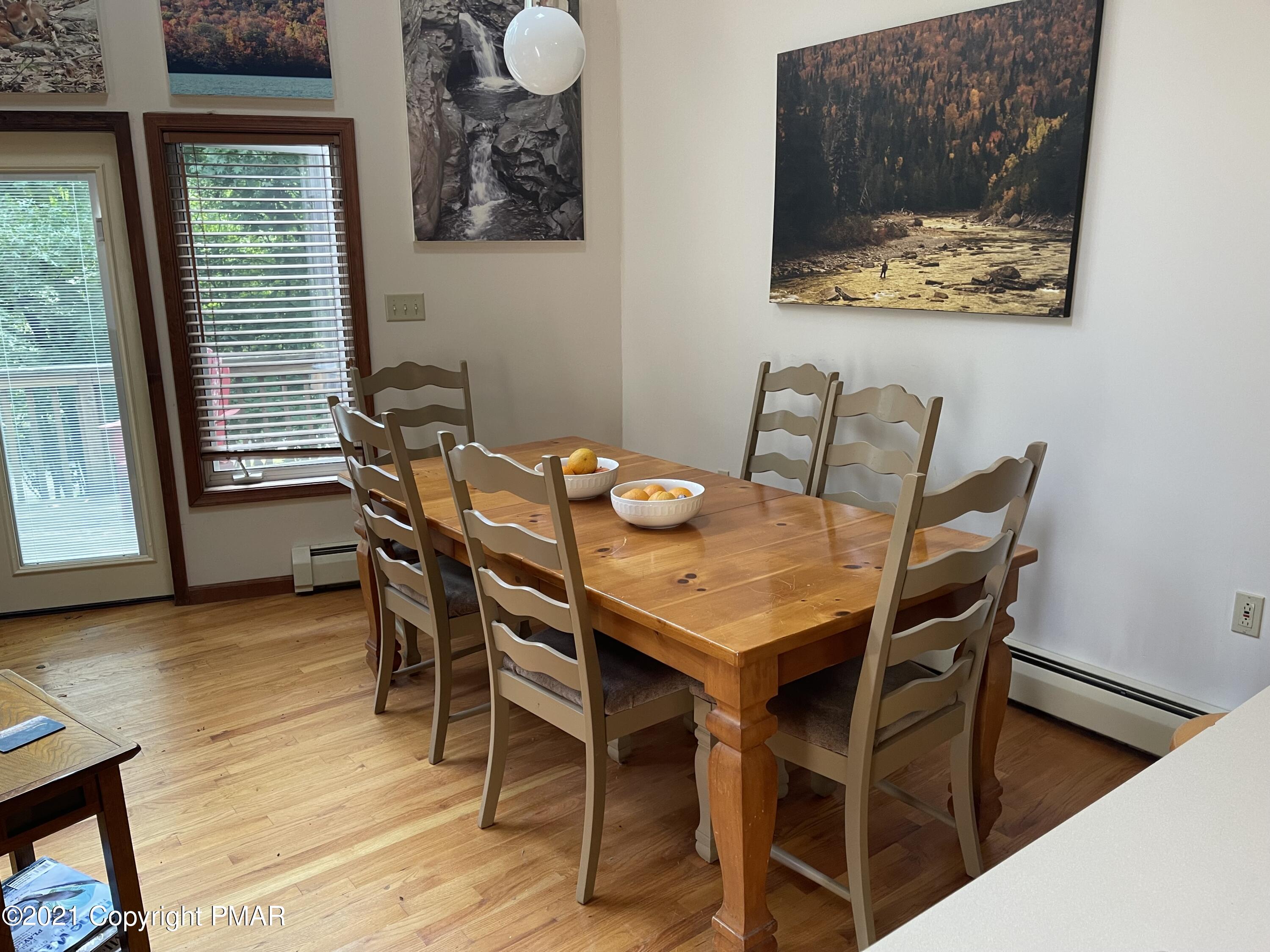 131 Maple Road Blakeslee, PA 18610 - Photo 10 of 35 a view of a dining room with furniture and wooden floor