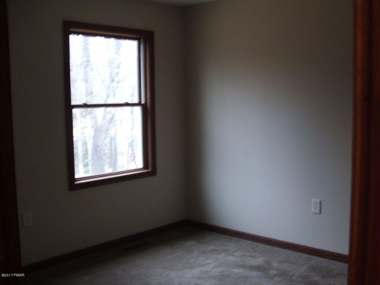 105 Butternut Road Milford, PA 18337 - Photo 2 of 8 an empty room with a window