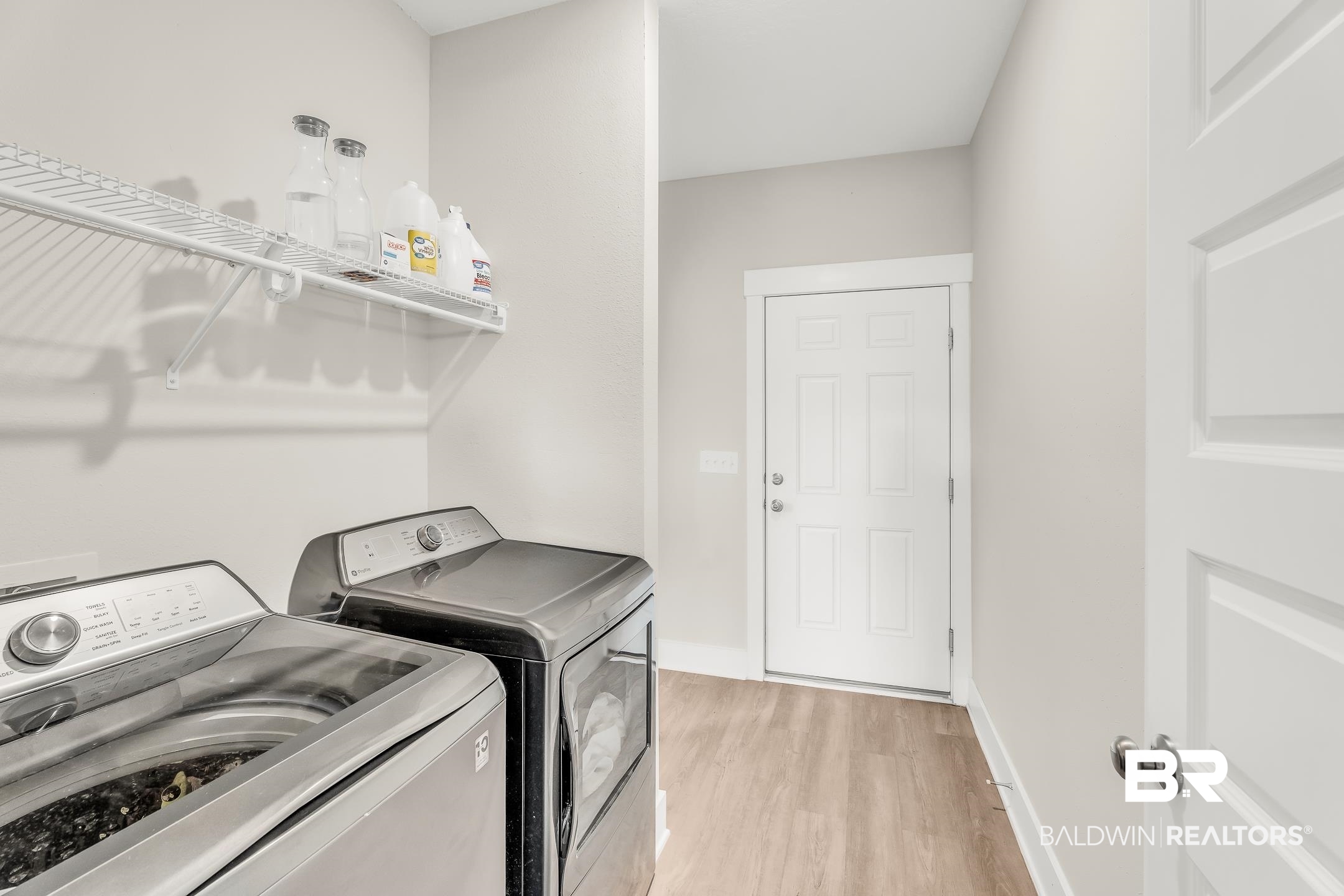 1720 Partridge Street Foley, AL 36535 - Photo 21 of 32 Clothes washing area with light hardwood / wood-style flooring and washer and clothes dryer