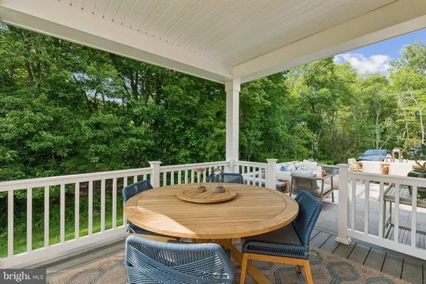 a view of a patio with a table chairs and a table