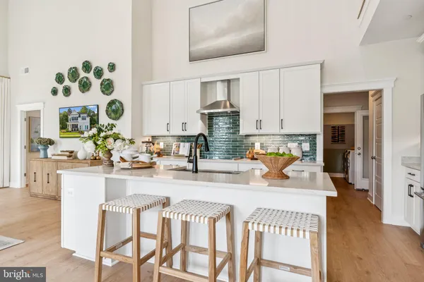 a kitchen with stainless steel appliances kitchen island granite countertop a sink and cabinets