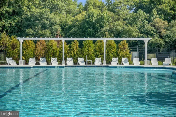a view of a swimming pool with a patio