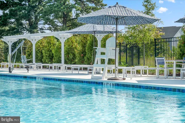 a view of a chairs and table in the patio