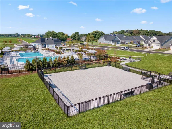 an aerial view of a house with a big yard