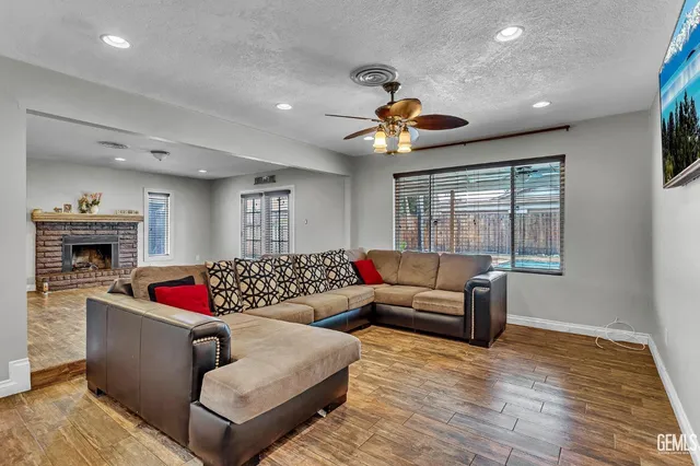 a living room with furniture fireplace and window