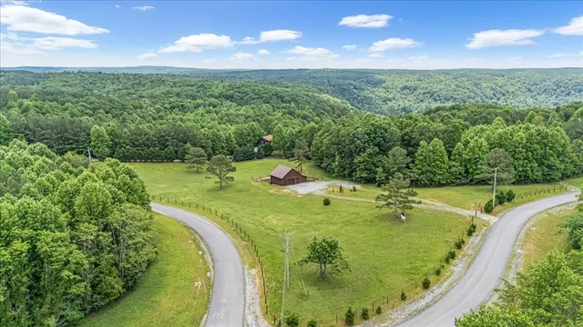 a view of a swimming pool with a yard