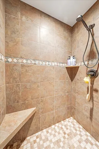 a bathroom with a bathtub and shower